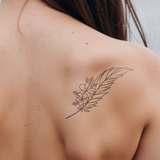 feather with flowers tattoo