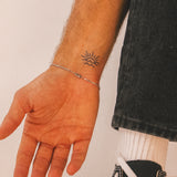 Sun And Waves Tattoo