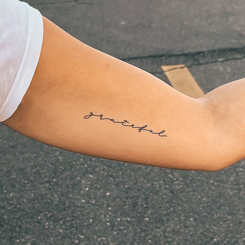 word tattoos on forearm